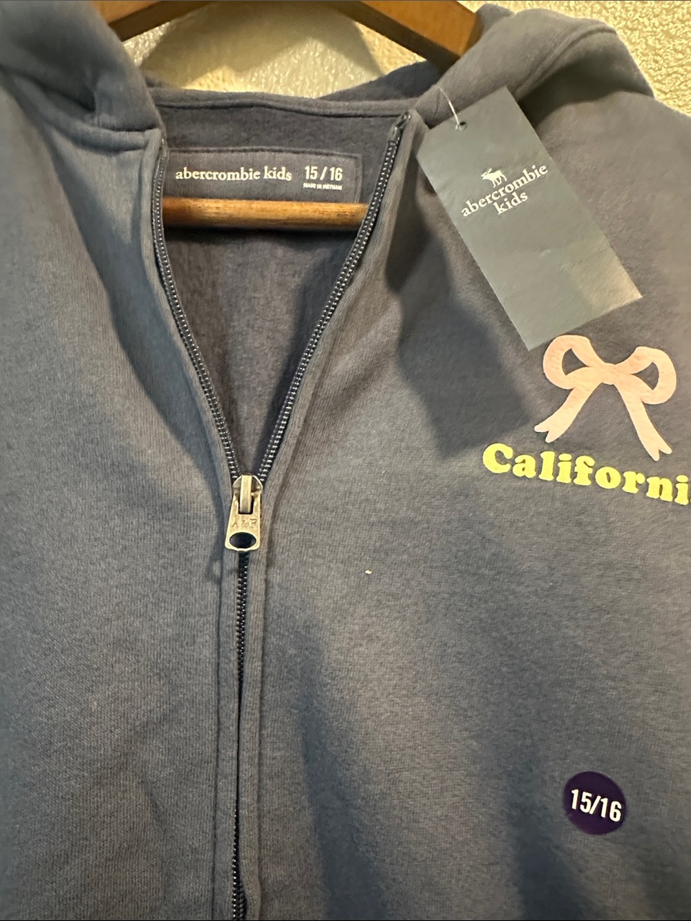 abercrombie kids navy zip hoodie with pink bow and yellow California text